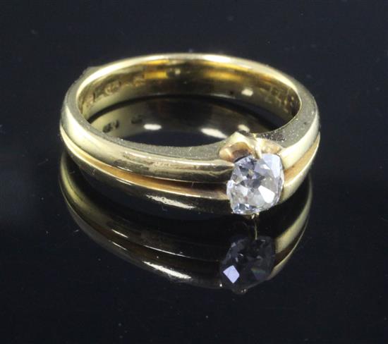 A 22ct gold and oval-cut diamond solitaire ring, size M.